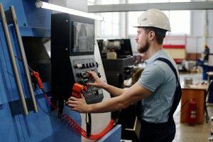 a worker operating cnc machine