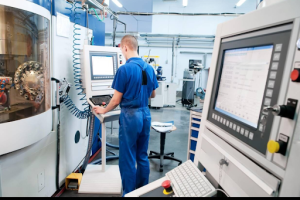 a person operating cnc machine