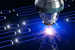A laser beam cutting through a metal plate, showcasing precision and technology in metal fabrication. 
