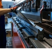 metal presswork process in industrial setting