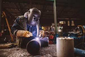 professional welder wearing wleding mask