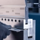 Person using metal cutting tool to slice through metal sheet