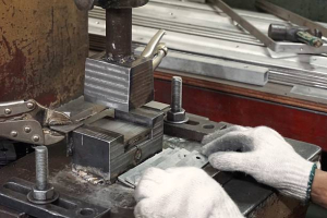 worker work on sheet metal stamping process
