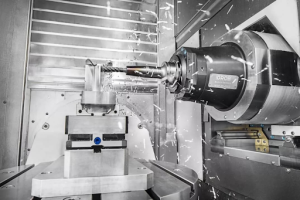 A CNC milling machine located within a metal building, highlighting its precision engineering