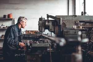 a worker handling drill bit machine