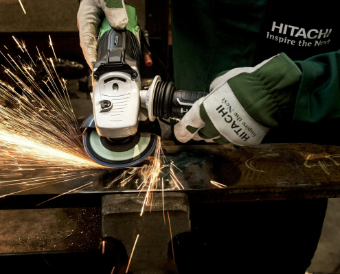 worker using metal welder