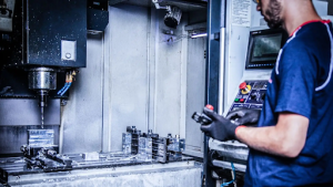 a worker performing cnc operation