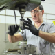 a worker operating cnc drilling machine