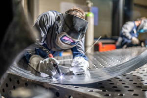 a worker doing metal fabrication work