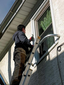a person using ladder stand-off