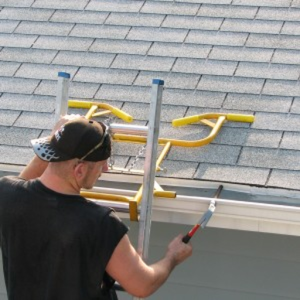 a person using a ladder stand-off