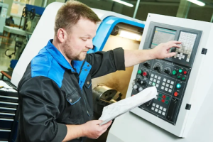 factory worker operating a machine