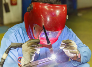 a worker wearing welding mask