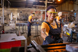 a factory worker handling metal